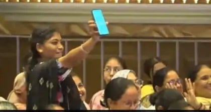 A woman attending CM Mann's rally in Dhuri received a message on her mobile phone, after which she showed the message to the CM. A woman attending CM Mann's rally in Dhuri received a message on her mobile phone, after which she showed the message to the CM.